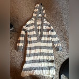 Grey and white hooded sweater. Has been worn.
